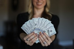 woman holding paper money